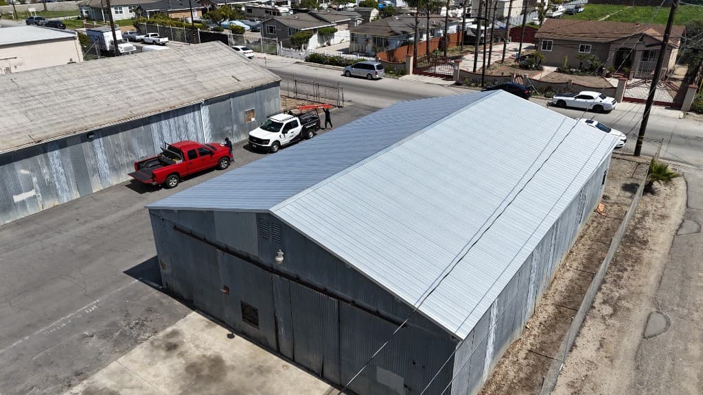 Aerial view of the same Oxnard building after new corrugated metal roof panels were installed