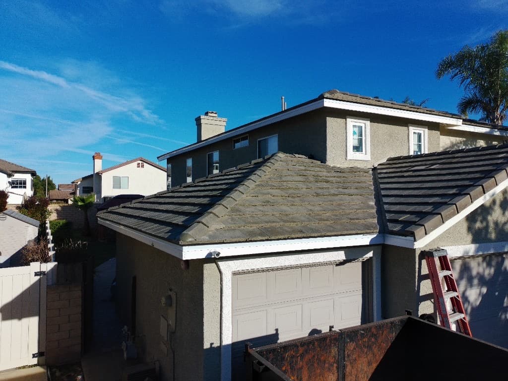 Multi-level flat roof under construction with white membrane