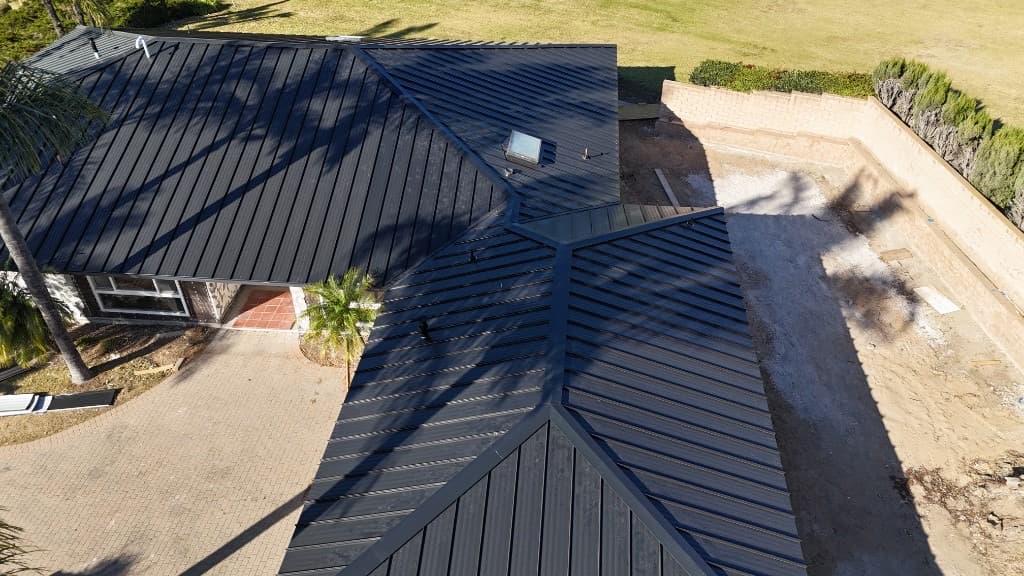 Drone photo of a completed gray tile residential roof