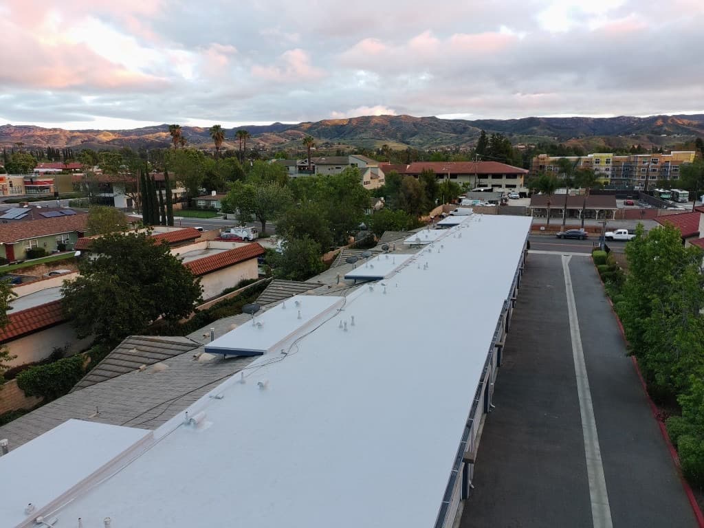Top-down drone photo of a home with a new roof